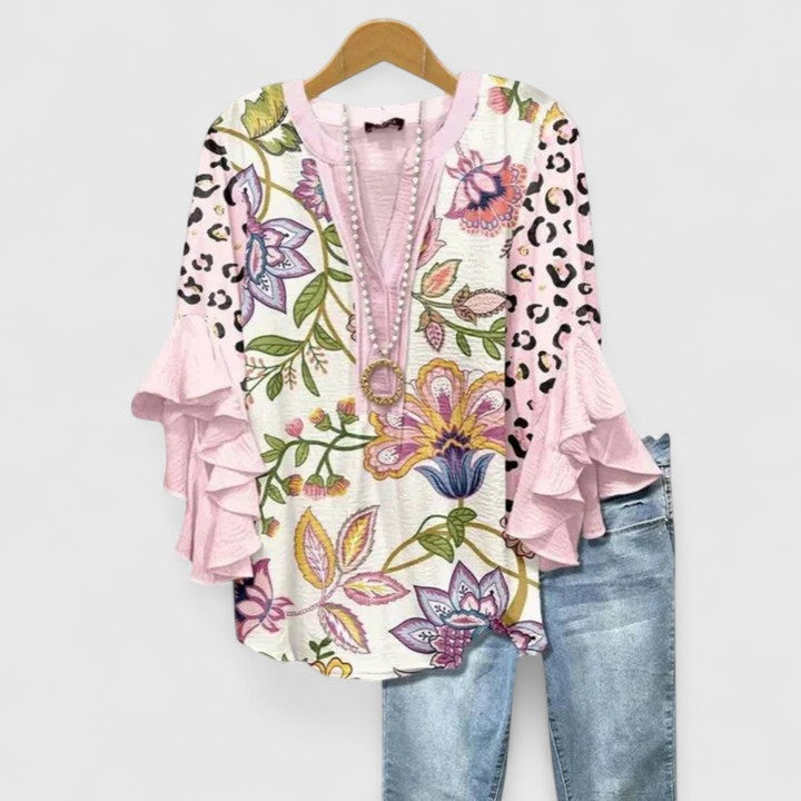 Elegant Isabel y Miguel Madrid blouse with a stylish design, featuring a flattering fit and sophisticated details.