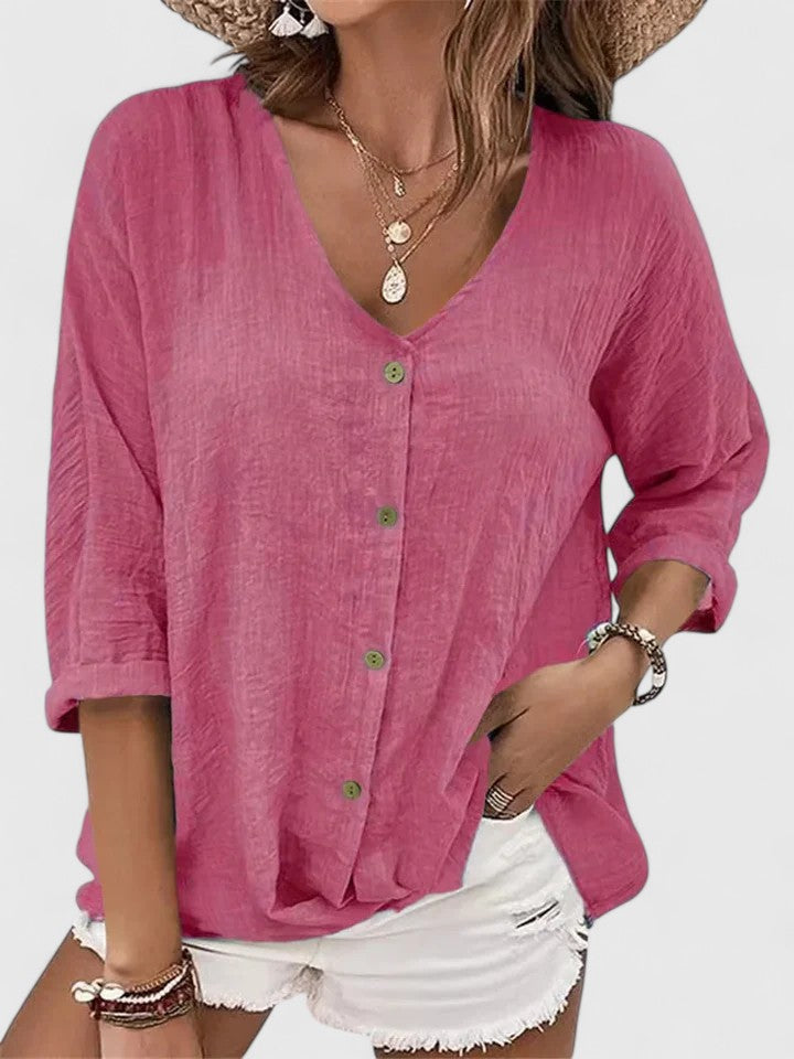 Isabel y Miguel Madrid Kylie Elegante Blusa in soft fabric with stylish design and long sleeves, displayed on a white background.