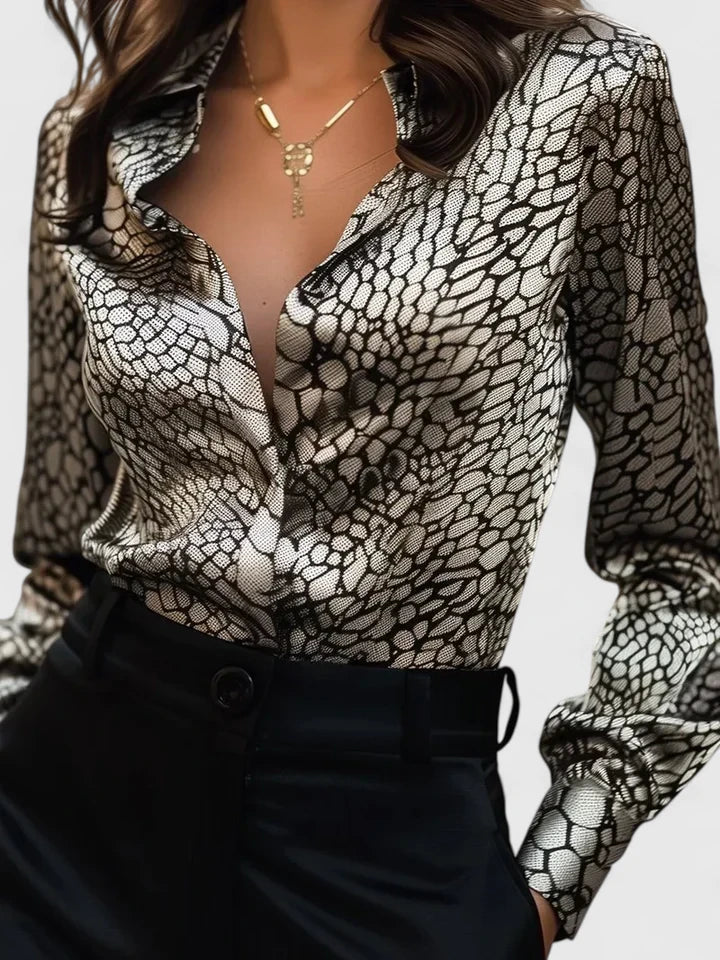 Elegant Lyzziane blouse by Isabel y Miguel Madrid, featuring a stylish design and soft fabric, displayed on a neutral background.