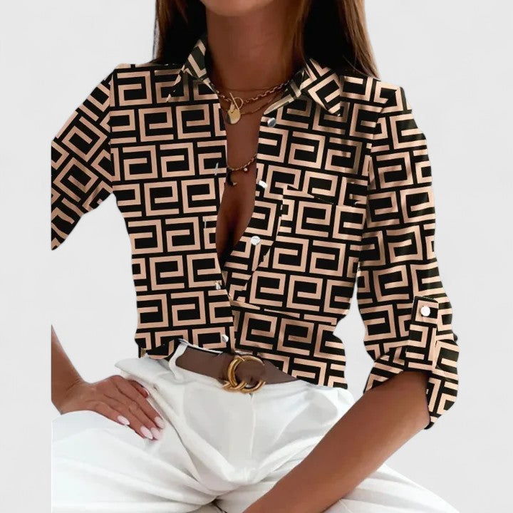 Elegant Lisette long-sleeve blouse by Isabel y Miguel Madrid, displayed on a mannequin with a stylish fit and classic design.