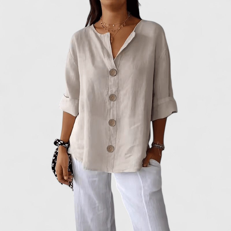 Elegant Isabel y Miguel Madrid Cathlyn blouse with stylish design, displayed in a well-lit fashion image.