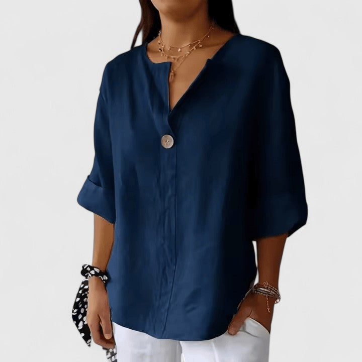 Elegant Isabel y Miguel Madrid Kianna blouse with a classic design, displayed in a stylish image showcasing the fabric and fit.