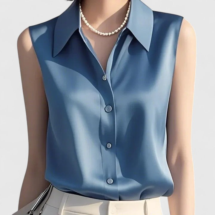Elegant Isabel y Miguel Madrid Lavinia blouse featuring sophisticated design, displayed on a neutral background.