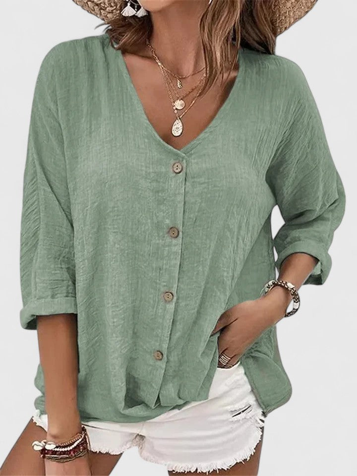Isabel y Miguel Madrid Kylie Elegante Blusa featuring a stylish, flowy fabric and sophisticated design in a neutral color.