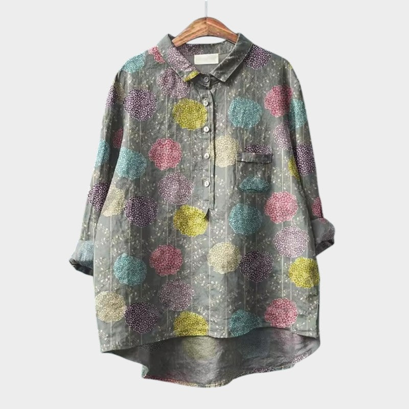Light blue women's blouse by Isabel y Miguel Madrid, featuring a relaxed fit with a round neckline and long sleeves.