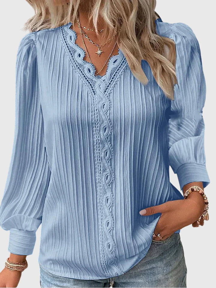 Andrea™ elegant jersey blouse by Isabel y Miguel Madrid, featuring a soft, stylish design with a round neckline and long sleeves.