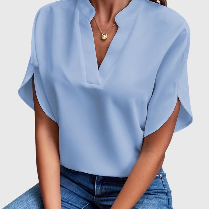 Elegant Kristie™ blouse by Isabel y Miguel Madrid, featuring a stylish design and feminine fit displayed on a model.
