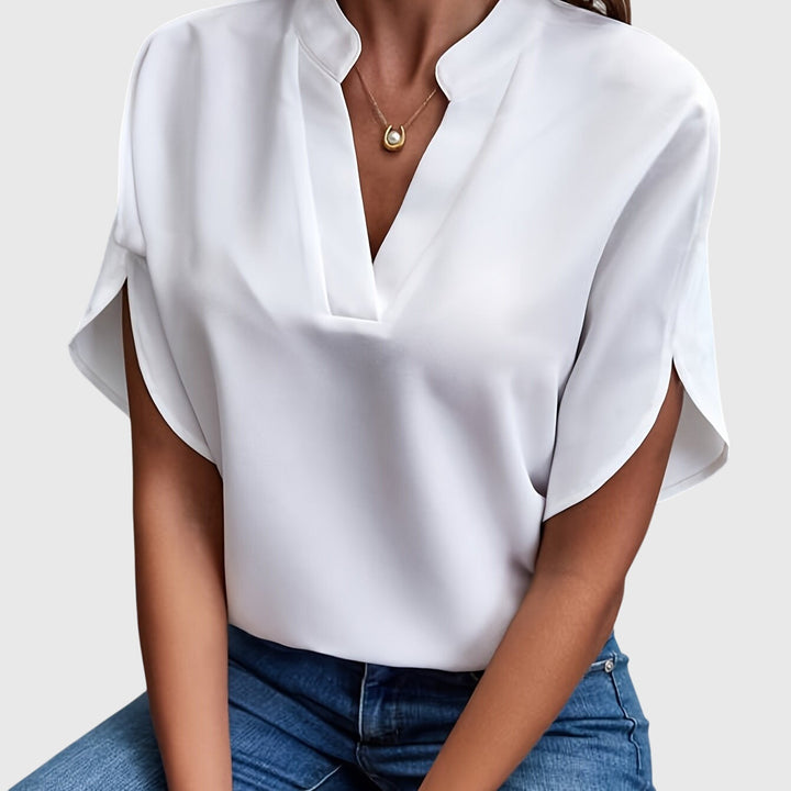 Elegant Kristie™ blouse by Isabel y Miguel Madrid, featuring a stylish, flowing design and sophisticated fabric details.