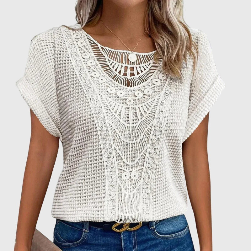 Isabel y Miguel Madrid Perla™ Ibiza-style elegant blouse with flowy fabric and intricate detailing, perfect for stylish summer wear.
