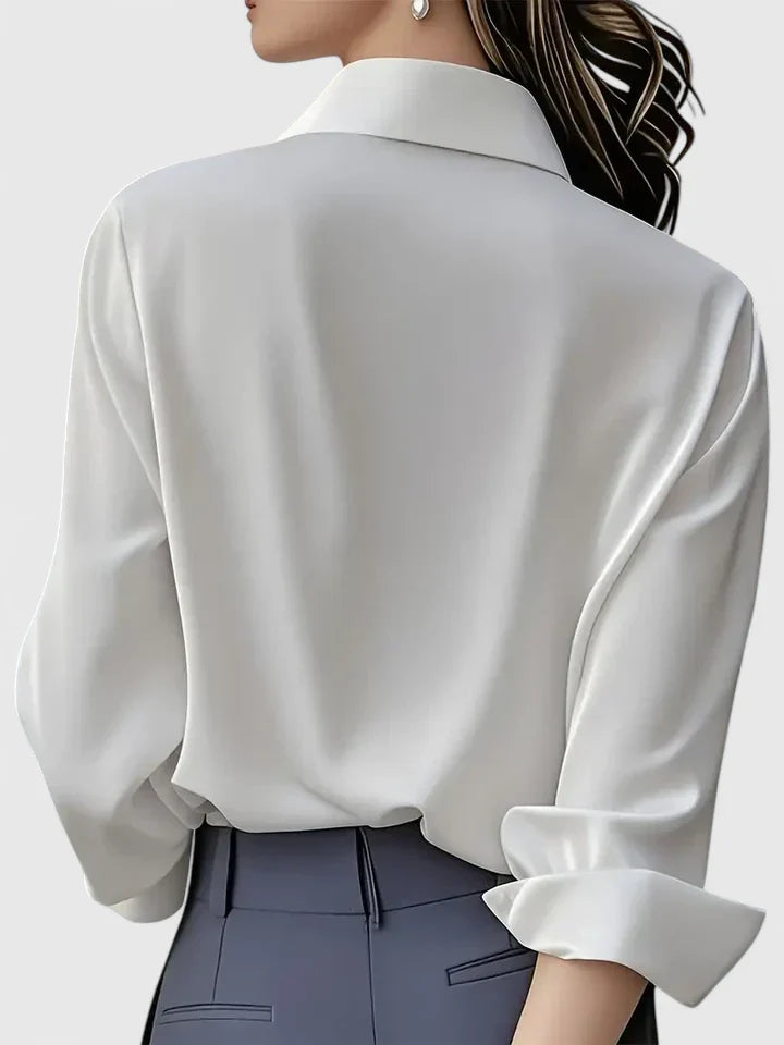 Elegant Melvaya top by Isabel y Miguel Madrid featuring a stylish design and sophisticated fabric, worn in a close-up view.