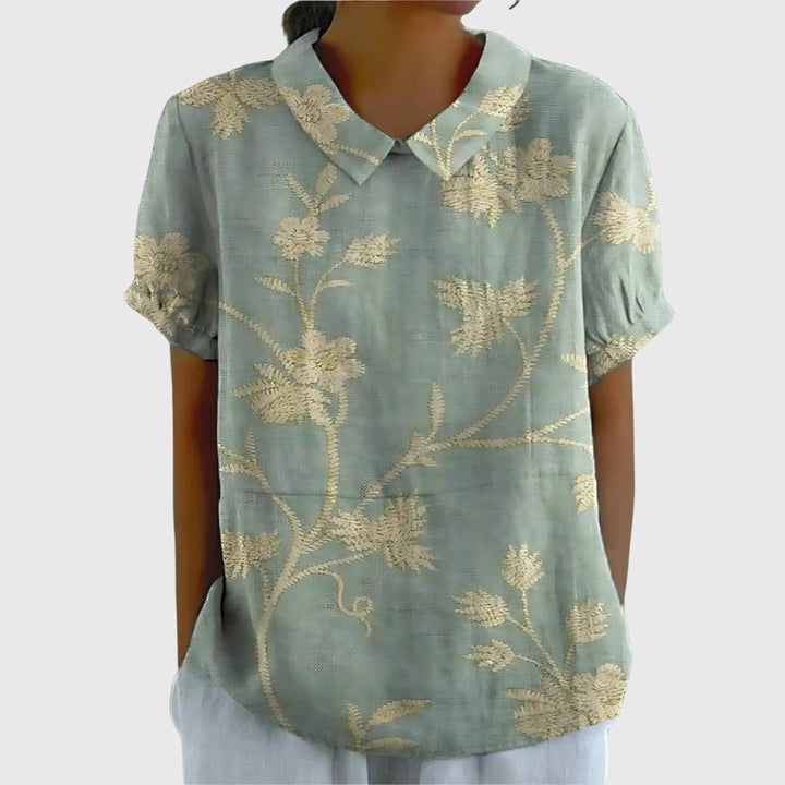Jenna™ floral blouse by Isabel y Miguel Madrid featuring a colorful floral pattern, lightweight fabric, and long sleeves.