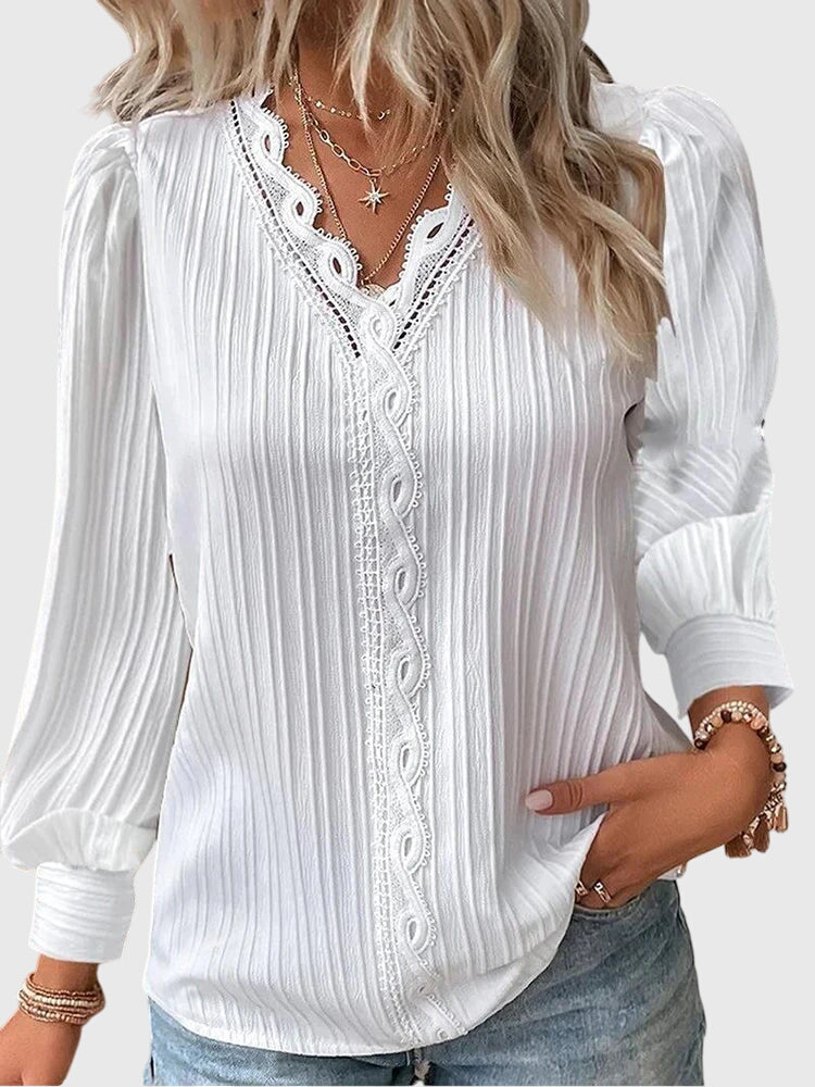 Andrea™ elegant jersey blouse by Isabel y Miguel Madrid, featuring a stylish, comfortable design with a fitted silhouette.
