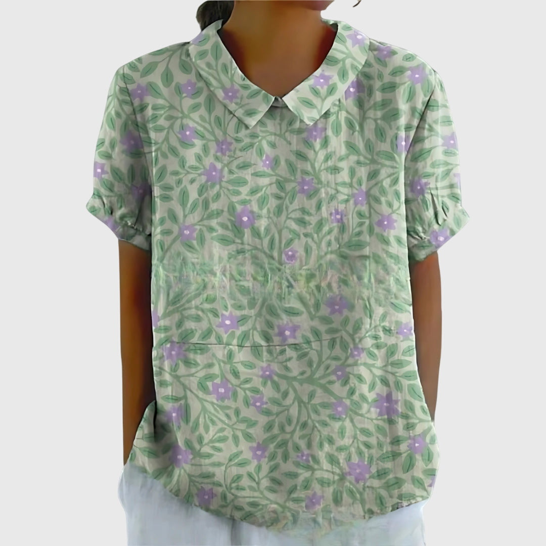 Isabel y Miguel Madrid Jenna floral blouse featuring vibrant colorful flower patterns and lightweight fabric.