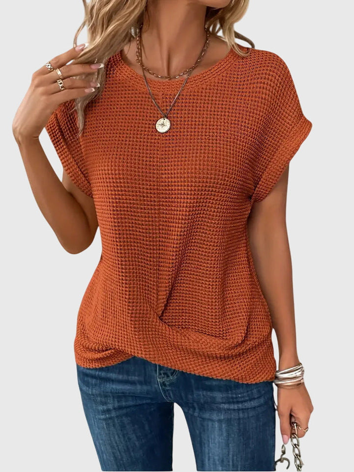 Isa™ Blusa Chic con Cuello Redondo by Isabel y Miguel Madrid, featuring a stylish round-neck design and elegant fabric.
