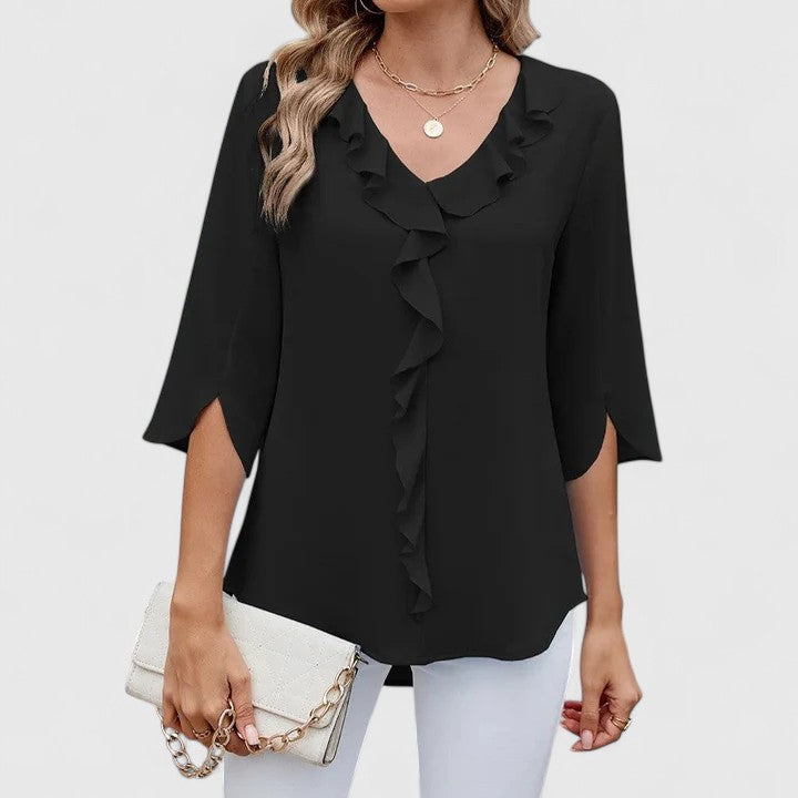 Elegant Debby blouse by Isabel y Miguel Madrid, featuring a stylish design in soft fabric, displayed on a neutral background.