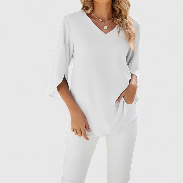 Elegant Isabel y Miguel Madrid Debby blouse in soft fabric with a stylish collar and button details, perfect for sophisticated outfits.