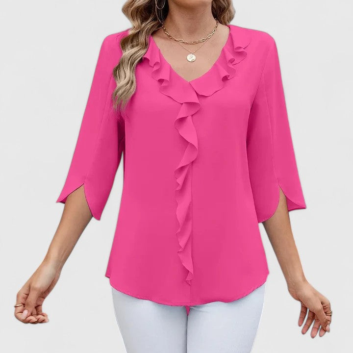 Elegant Debby blouse by Isabel y Miguel Madrid, featuring a stylish design and sophisticated look, displayed on a white background.