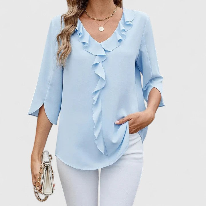 Elegant Debby blouse by Isabel y Miguel Madrid, featuring a stylish design and lightweight fabric, displayed on a mannequin.