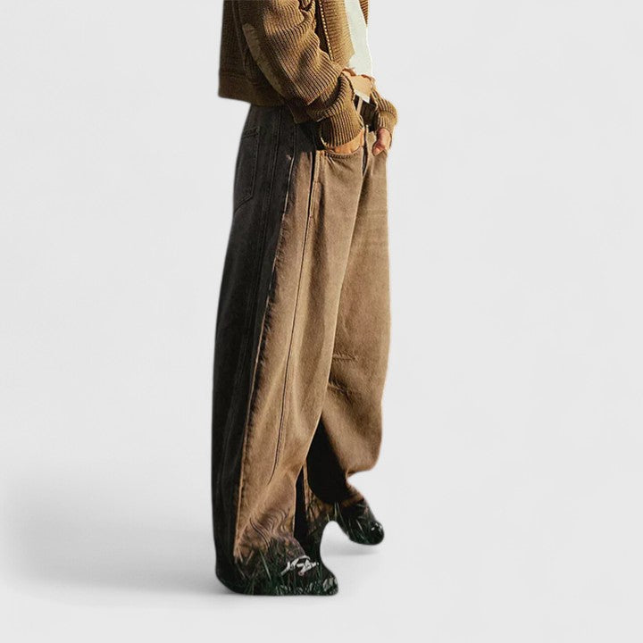 Pantalones amplios y cómodos de lluvia Isabel y Miguel Madrid, con detalles de tela y ajuste relajado.
