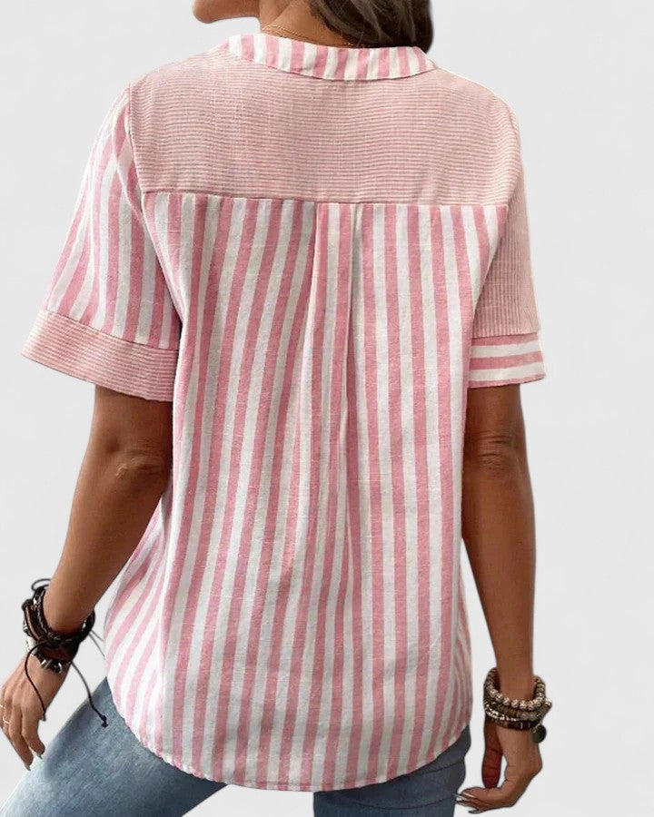 Isabel y Miguel Madrid Gigi sophisticated blouse featuring elegant fabric and stylish design, shown on a model.