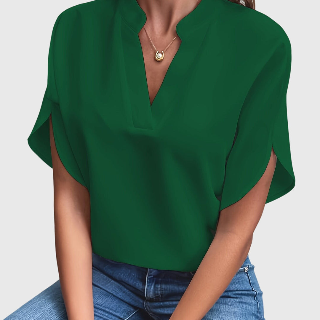 Elegant Kristie™ blouse by Isabel y Miguel Madrid, featuring stylish fabric and classic design, shown in a close-up view.