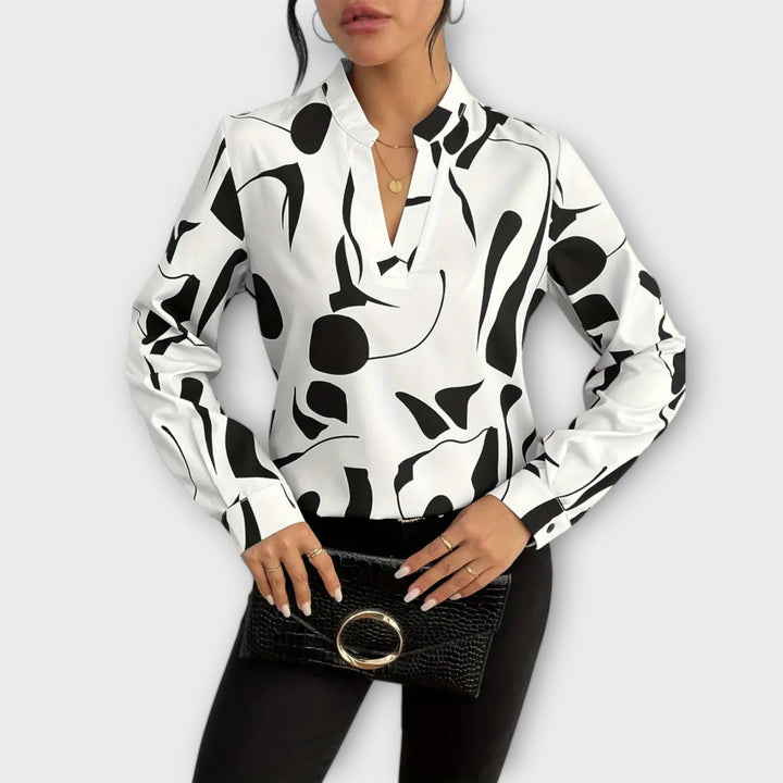 Elegant Lara™ blouse by Isabel y Miguel Madrid featuring a unique style, displayed on a model in a well-lit setting.