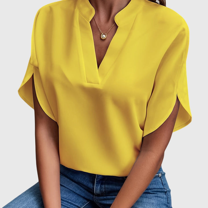 Elegant Kristie™ blouse by Isabel y Miguel Madrid, featuring a stylish design and lightweight fabric, shown on a model.