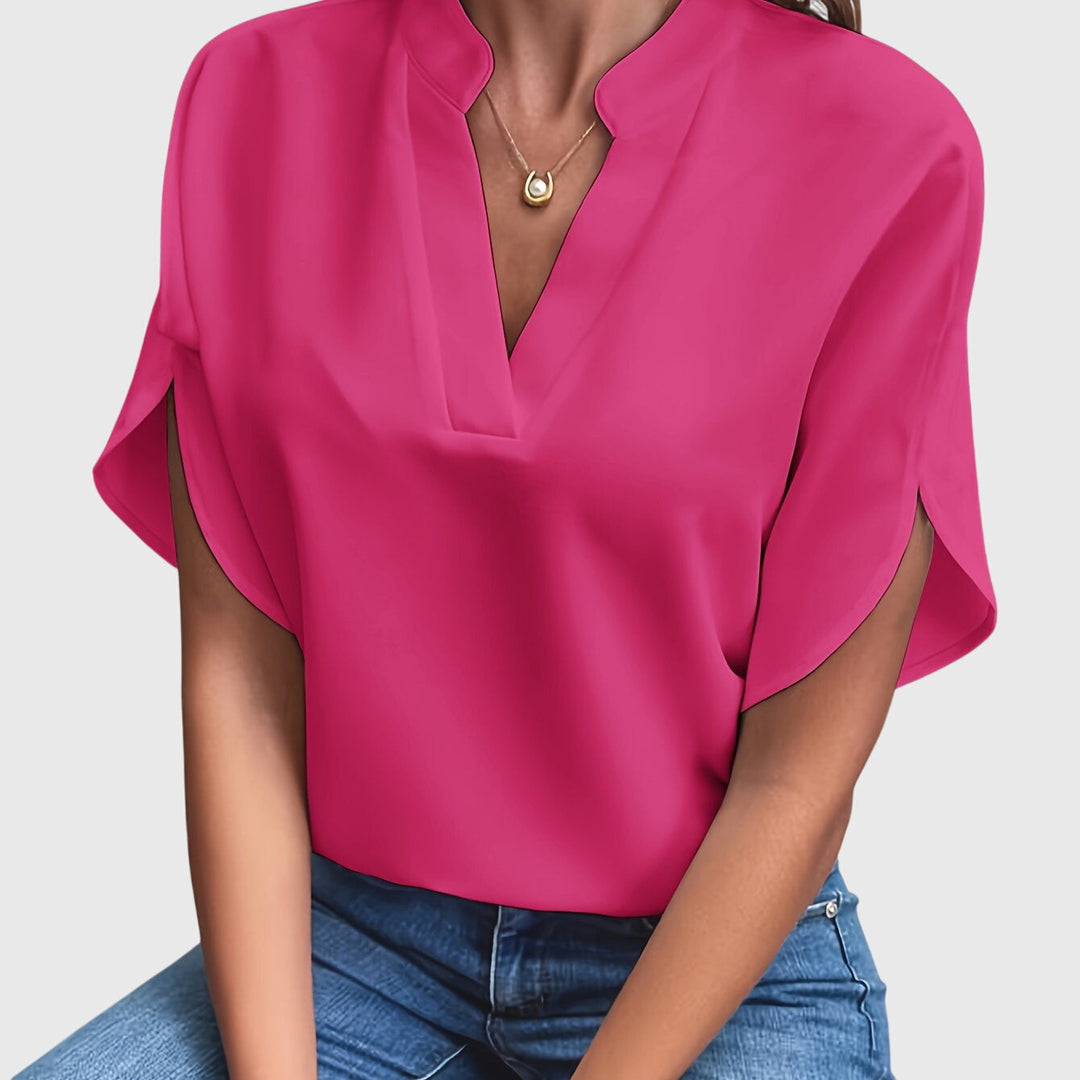 Elegant Kristie™ blouse by Isabel y Miguel Madrid, showcasing a stylish design with detailed fabric and a flattering fit.