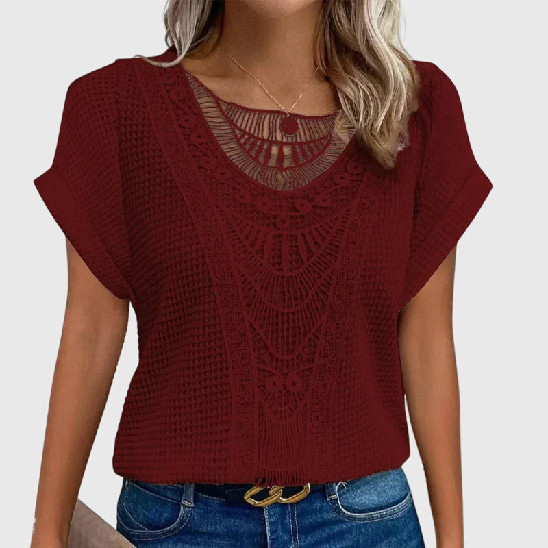 Isabel y Miguel Madrid Perla™ Ibiza style elegant blouse with flowing fabric and intricate detailing, perfect for stylish summer wear.