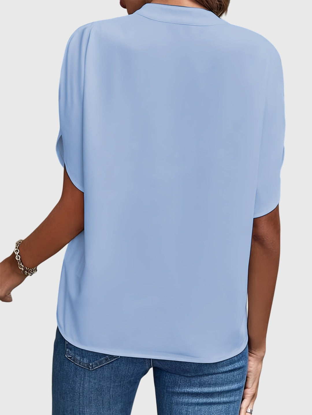 Elegant Kristie™ blouse by Isabel y Miguel Madrid, featuring stylish fabric and a sophisticated design, perfect for formal wear.