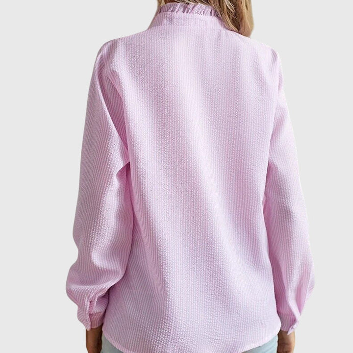 Elegant Kaitlyn™ blouse by Isabel y Miguel Madrid, featuring a stylish, flowy design perfect for sophisticated looks.