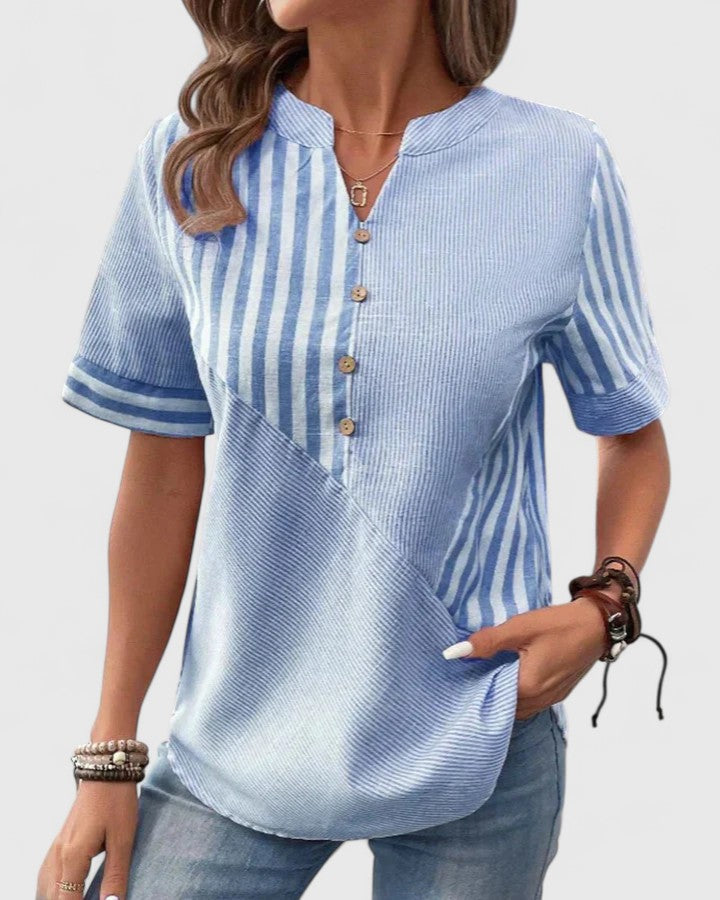 Elegant Gigi blouse by Isabel y Miguel Madrid featuring sophisticated design and soft fabric, displayed on a plain background.